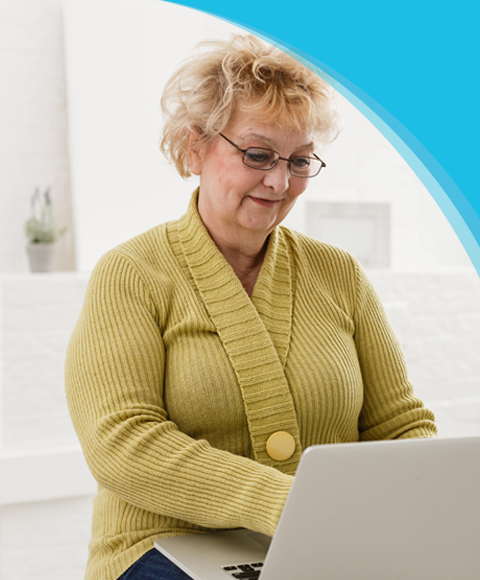 FAQs | Canadian Hard Of Hearing Association - Woman looking at device smiling